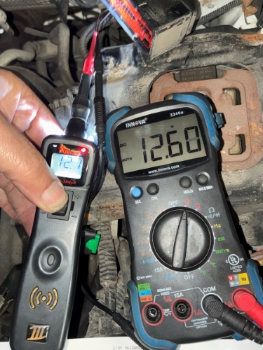 Multimeter showing the voltage drop during ABS diagnostics on Ford Transit - Auto Repair San Antonio | Auto Service Experts Multimeter showing the voltage drop during ABS diagnostics on Ford Transit