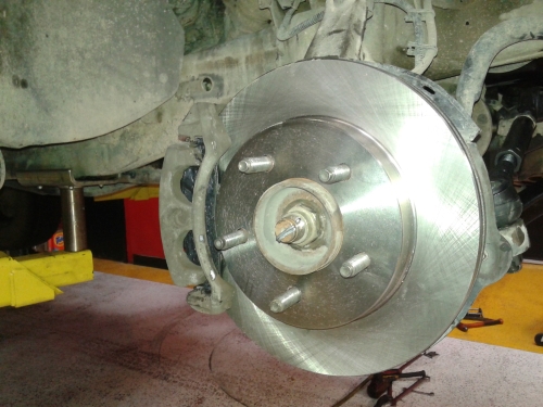 Brake pads and rotors replacement at top-rated auto repair shop in Hill Country Village - Auto Repair San Antonio | Auto Service Experts Tires removed from vehicle during complete brake job in Hill Country Village at Auto Service Experts.