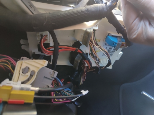 Body Control Module location inside Dodge Charger - Auto Repair San Antonio | Auto Service Experts Body Control Module location and connectors accessed for back-probing during fuel level circuit verification.