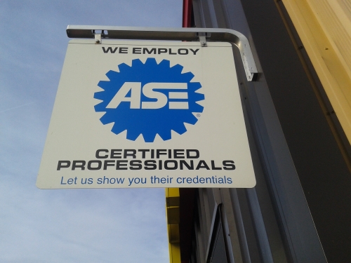 ASE Certified Car Mechanic Sign on Auto Service Experts San Antonio Vehicle Repair Shop - Auto Repair San Antonio | Auto Service Experts Sign posted on Auto Service Experts San Antonio Auto repair shop building verifies that it employs highly trained and experienced ASE Certified Technicians.