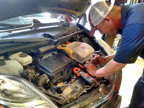 ASE Mechanics performing check engine light diagnostic near Alamo Heights San Antonio TX - Auto Repair San Antonio | Auto Service Experts ASE Mechanic performing check engine light diagnostic near Alamo Heights.