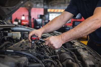ASE Technician Performing Engine Repair in Auto Shop Near Shavano Park - Auto Repair San Antonio | Auto Service Experts ASE Master Mechanic performing engine repair inside Auto Service Experts shop serving Shavano Park drivers.
