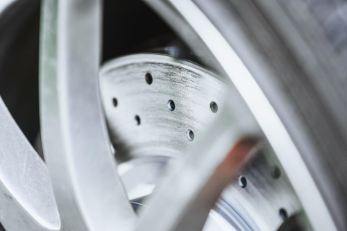brake-rotor-surface-scoring-auto-repair-Auto-Service-Experts - Auto Repair San Antonio | Auto Service Experts Brake rotor and wheel inspection for squeaking noise when braking at Auto Service Experts auto repair shop in San Antonio.