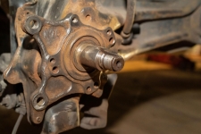 Wheel hub assembly inspection during brake vibration diagnostic process.