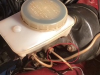 Auto-Service-Experts-Brake-Master-Cylinder-Rear-Seal-Leak - Auto Repair San Antonio | Auto Service Experts Brake caliper fluid leak inspection performed at Auto Service Experts San Antonio.