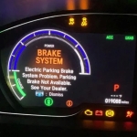 Auto-Service-Experts-Electronic-Parking-Brake-Warning-Display - Auto Repair San Antonio | Auto Service Experts Electronic parking brake warning illuminated on modern instrument cluster.