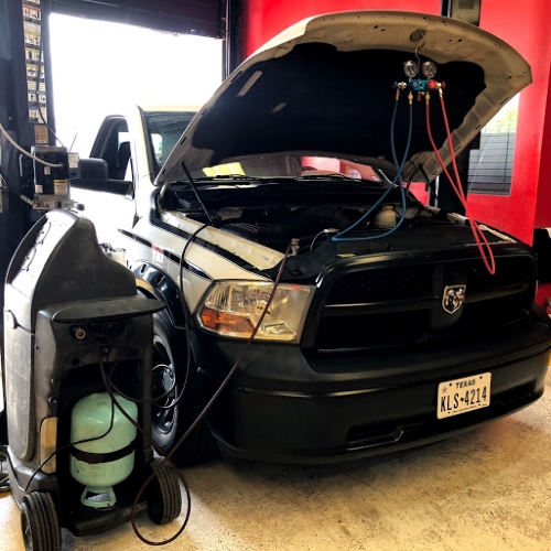 Professional AC equipment used during AC Check on Dodge Truck at Auto Service Experts in San Antonio TX - Auto Repair San Antonio | Auto Service Experts Technicians at Auto Service Experts San Antonio auto ac repair shop use specialized equipment to perform ac check on Dodge truck.