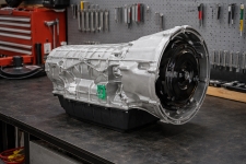 ford-f150-10r80-transmission-assembly-bench – Auto Repair San Antonio | Auto Service Experts Ford & Lincoln 10R80 transmission assembly placed on a workbench with clean casing and electrical connectors visible, showing a typical inspection setup at Auto Service Experts