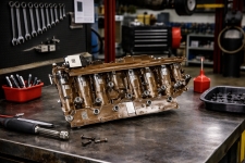 gm-transmission-worn-valve-body-bore-high-mileage – Auto Repair San Antonio | Auto Service Experts Worn valve body bore and internal wear pattern from a high-mileage GM transmission, demonstrating how pressure loss develops over time when fluid service is missed or delayed