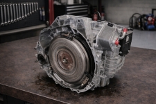 honda-cvt-rebuilt-transmission-crv-hrv-fit-insight – Auto Repair San Antonio | Auto Service Experts Rebuilt Honda & Acura CVT transmission with updated belt and pulley components set on the workbench, where Mario Negron inspects ratio control operation before reinstalling in the vehicle