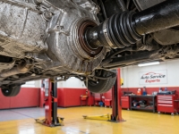output-shaft-axle-seal-fluid-leak-transmission – Auto Repair San Antonio | Auto Service Experts transmission fluid tracking along the axle shaft and dripping from the seal area, a common issue Mario Negron, Technician, finds during undercar inspections at Auto Service Experts