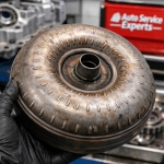 torque-converter-worn-lockup-surface – Auto Repair San Antonio | Auto Service Experts Torque converter showing wear and internal damage that can lead to slipping at highway speeds, evaluated during transmission diagnostics in San Antonio.