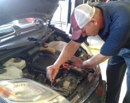 Transmission Code Diagnosis | Auto Service Experts β Auto Repair San Antonio | Auto Service Experts ASE technician scanning vehicle with transmission code check engine light in San Antonio.